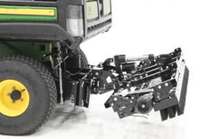 Utility vehicle with attached turf maintenance equipment