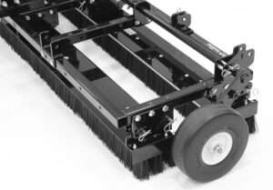 Industrial floor sweeper brush attachment with wheel